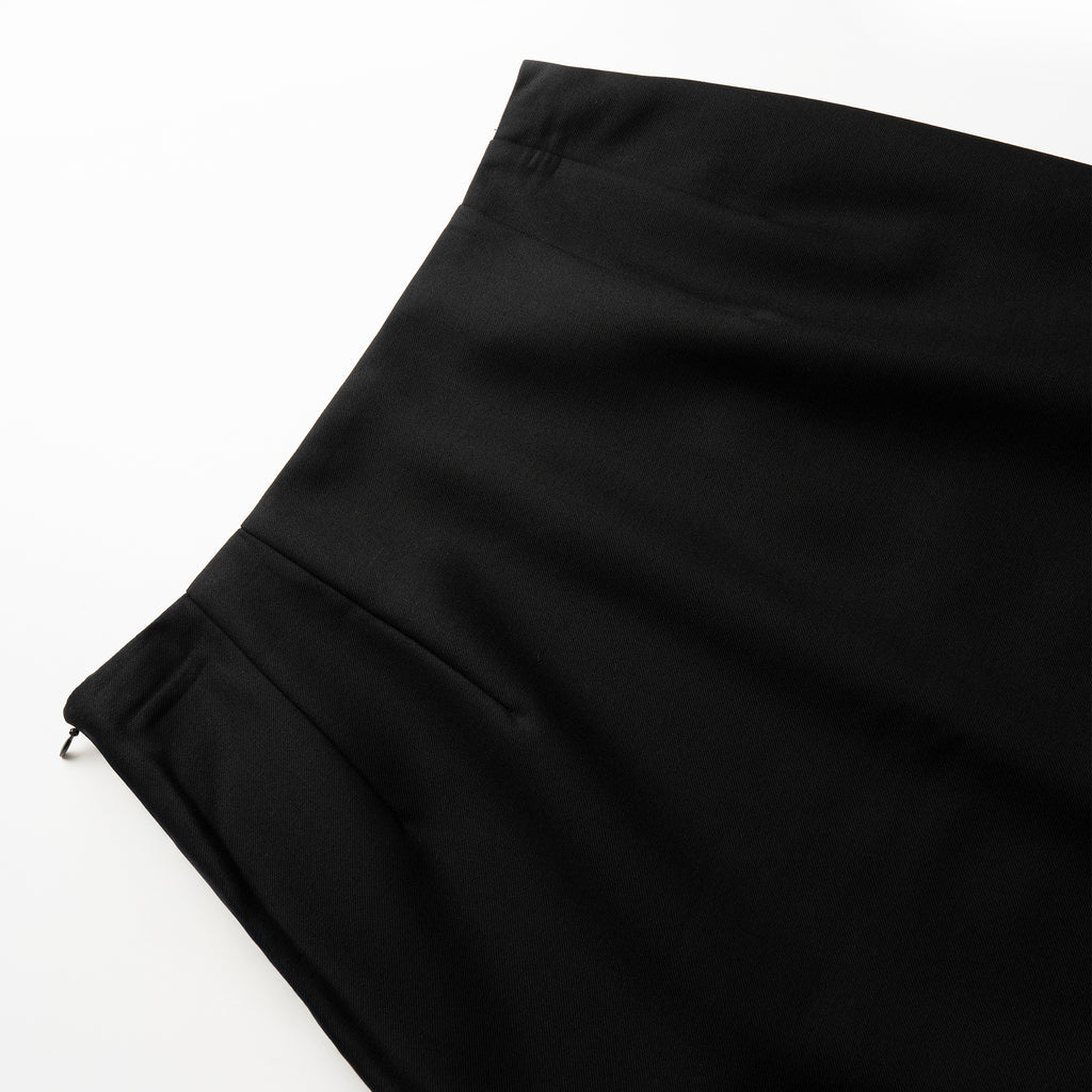 Close-up of black skirt on a white background