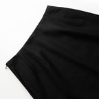 Close-up of black skirt on a white background