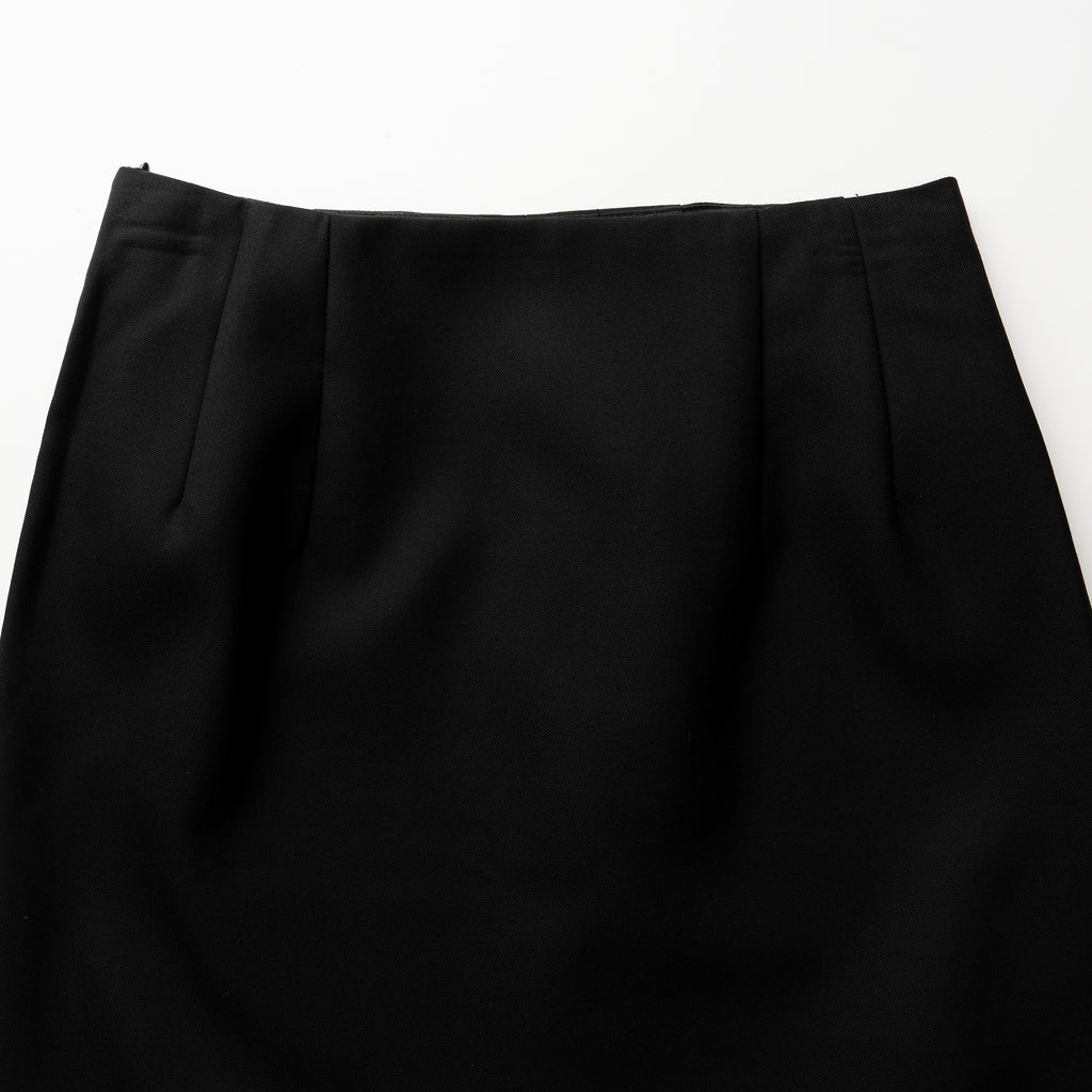 Close-up of a black skirt on a white background