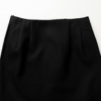 Close-up of a black skirt on a white background