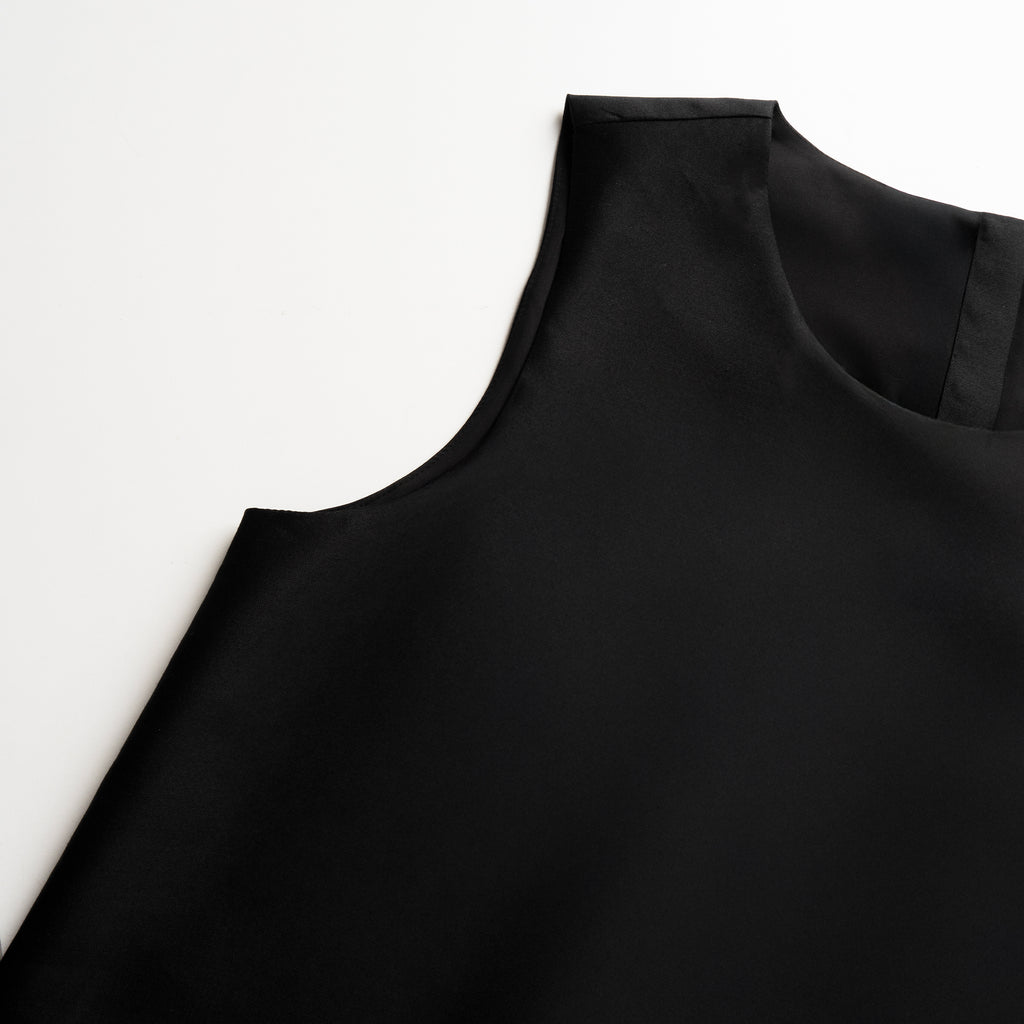 Black tunic on a white background
