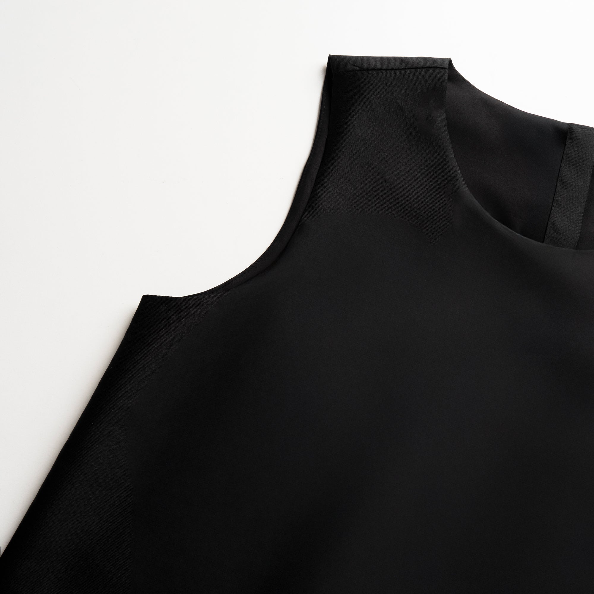 Black tunic on a white background