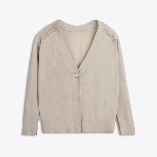 Beige cardigan on a light beige background