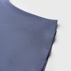 Blue fabric folded on a light gray background