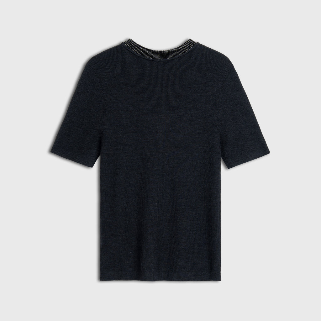 Black wool knit with a textured collar on a light gray background