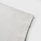Close-up ofwhite tank on a white background
