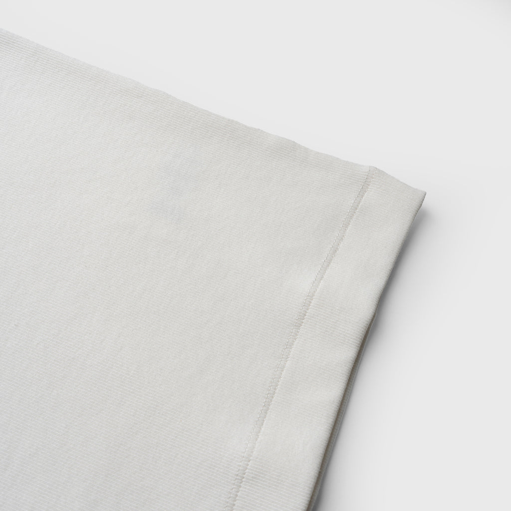 Close-up ofwhite tank on a white background