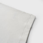 Close-up ofwhite tank on a white background