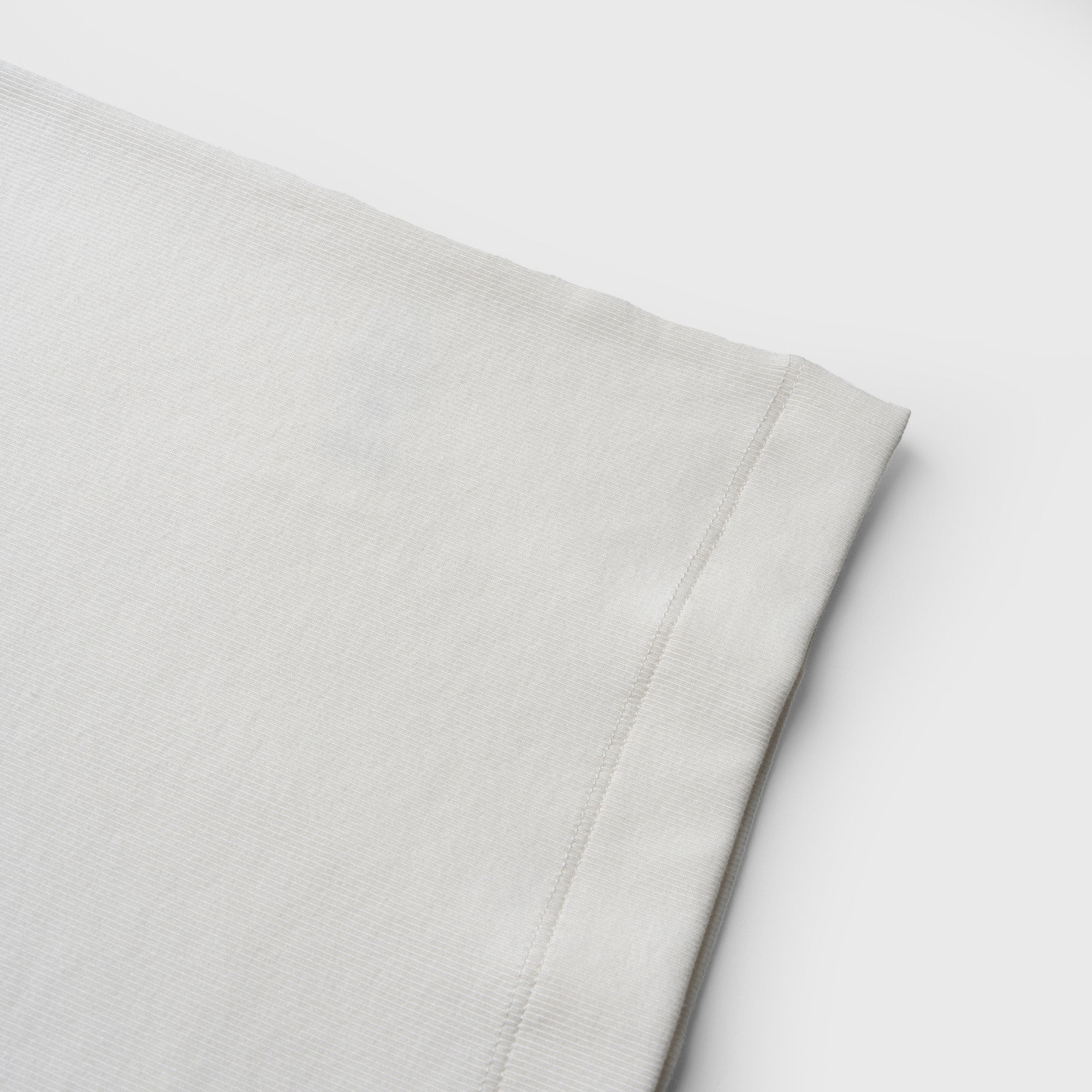 Close-up ofwhite tank on a white background