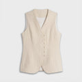 Beige vest on a light gray background