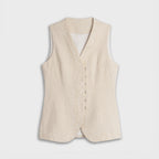 Beige vest on a light gray background