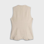 Beige sleeveless top on a light gray background