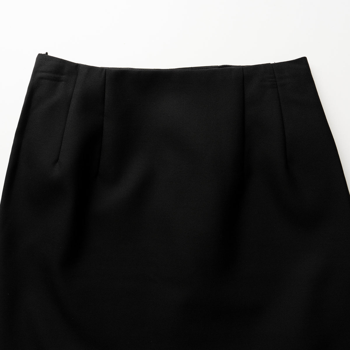 Close-up of a black skirt on a white background