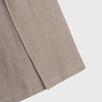 Close-up of a brown hemp skirt piece on a light gray background