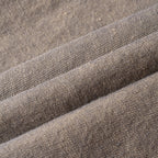 Close-up of brown textured hemp skirt with visible stitching