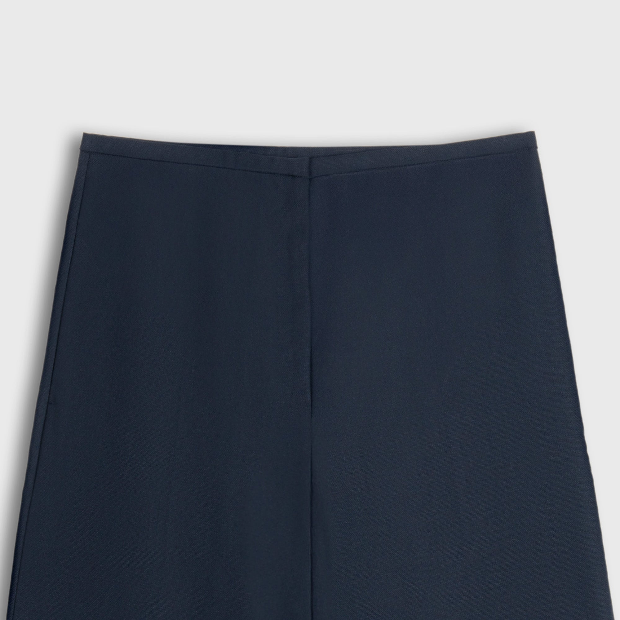 Navy blue pants on a light gray background