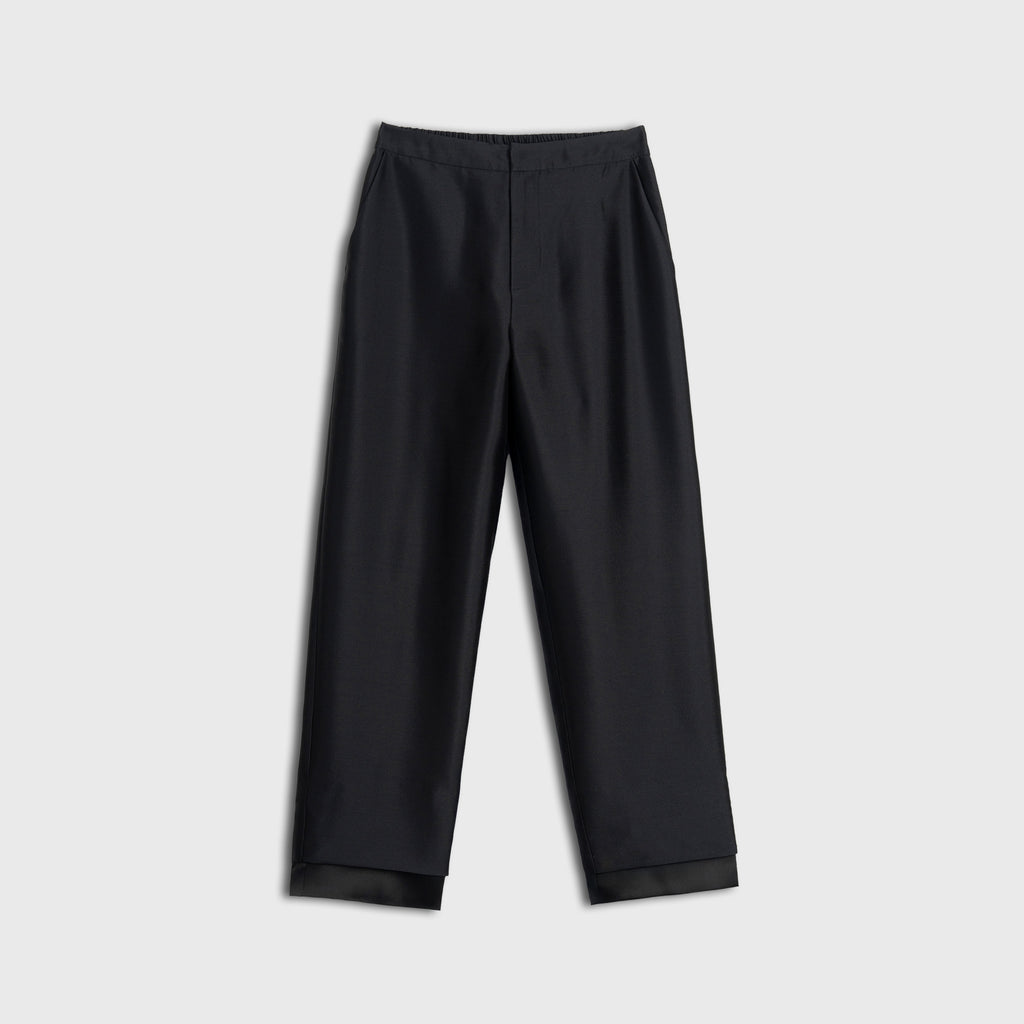 Black pants on a light gray background