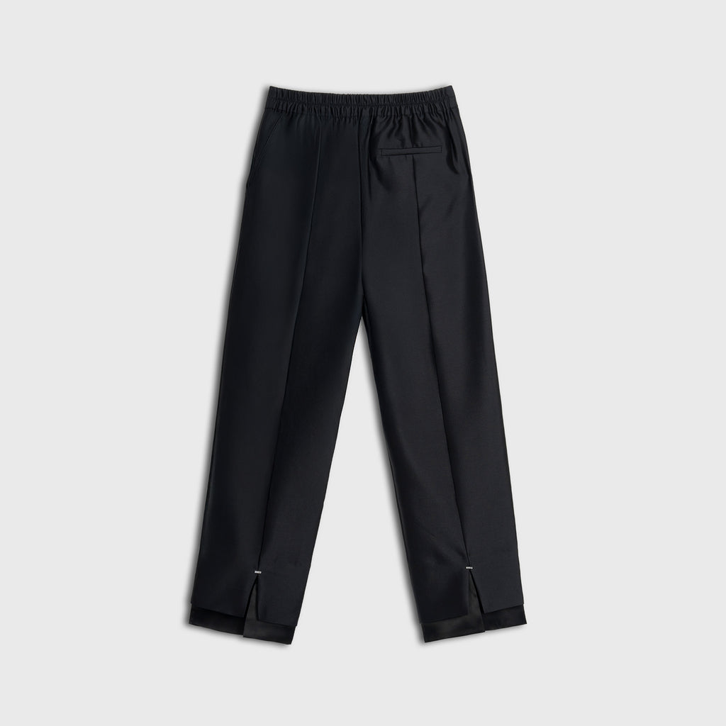 Black pants on a light gray background