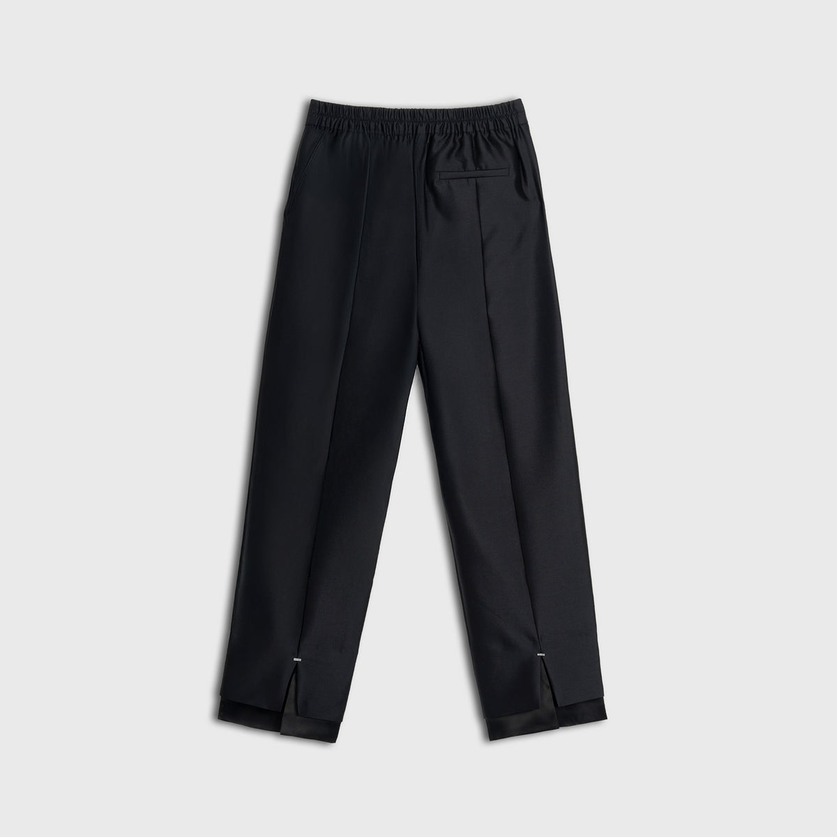 Black pants on a light gray background