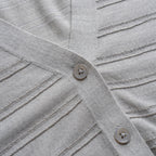 Close-up of a gray textured fabric with buttons