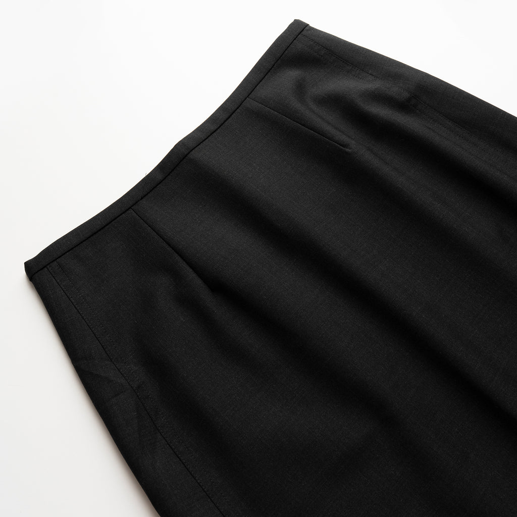 Close-up of a black wool skirt on a white background