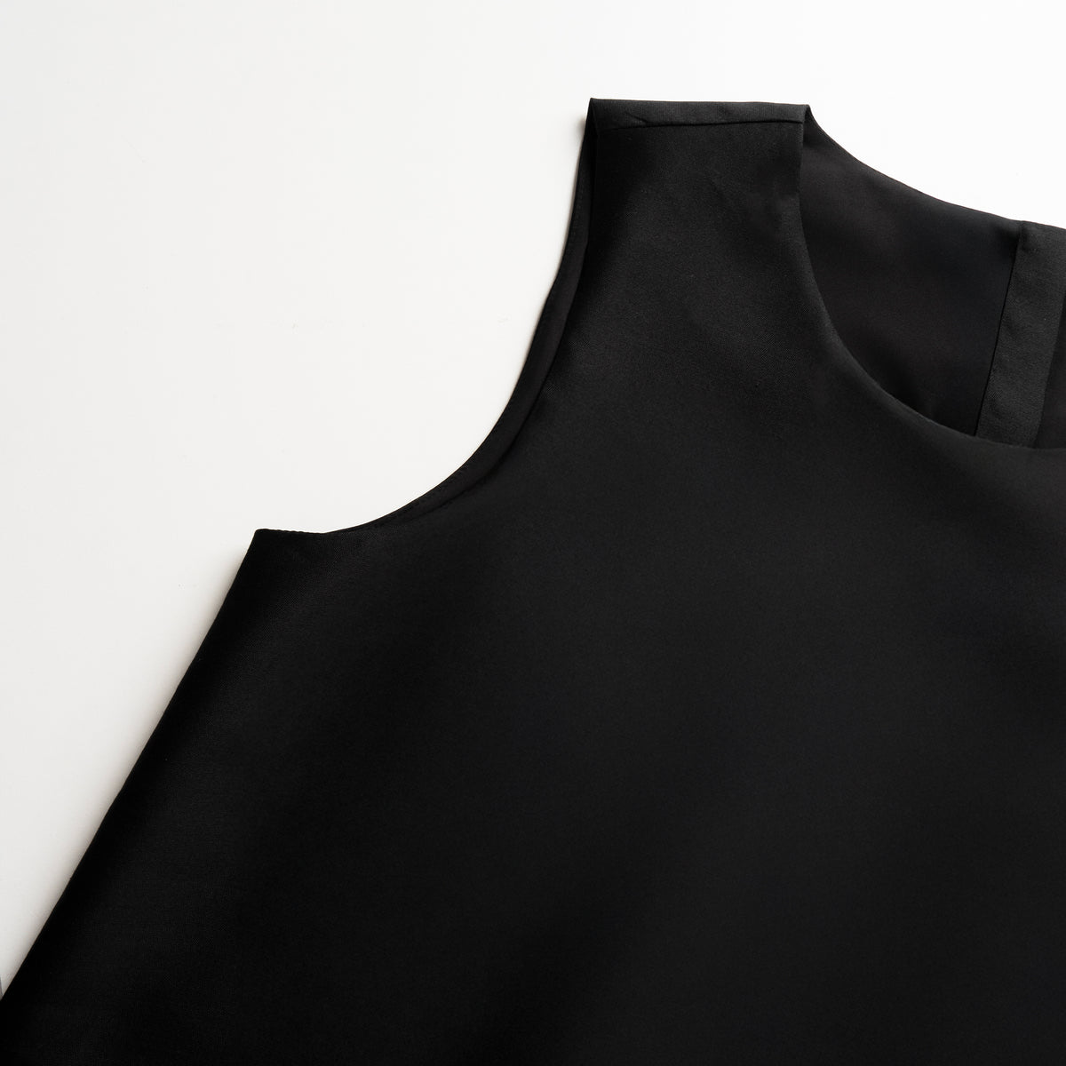 Black tunic on a white background