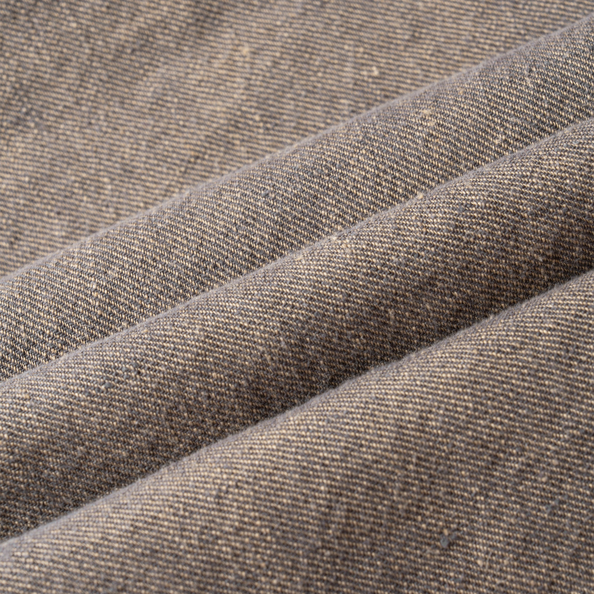 Close-up of brown textured hemp skirt with visible stitching