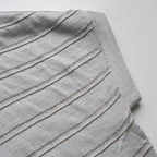 Gray pleated cardigan on a white background