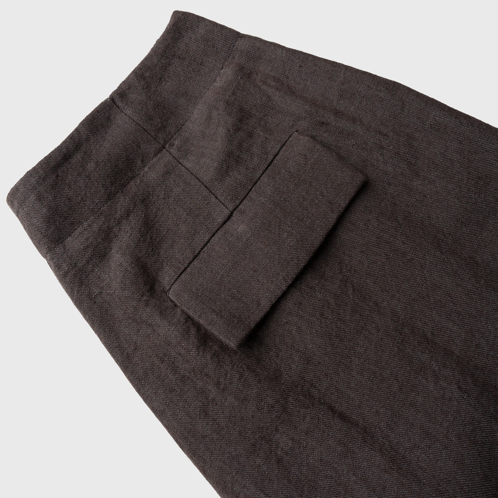 Dark brown pants with a pocket on a light gray background