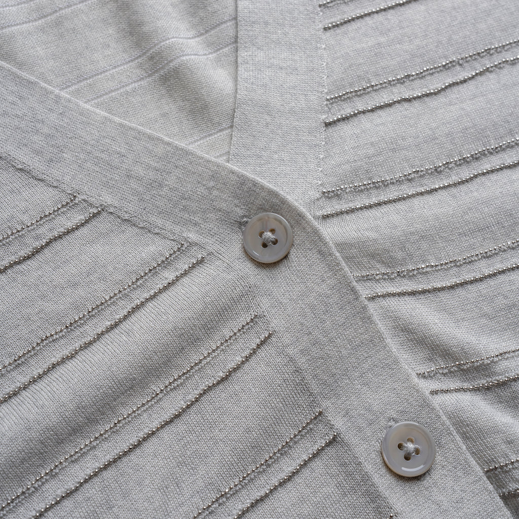 Close-up of a gray textured fabric with buttons