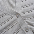 Close-up of a gray textured fabric with buttons