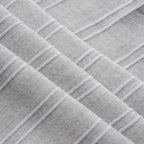Close-up of textured gray fabric with a diamond pattern